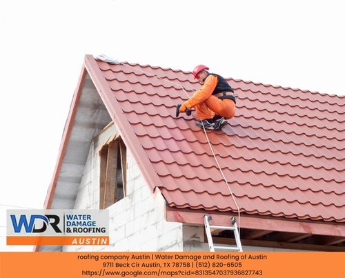 roofer working on a metal roofing